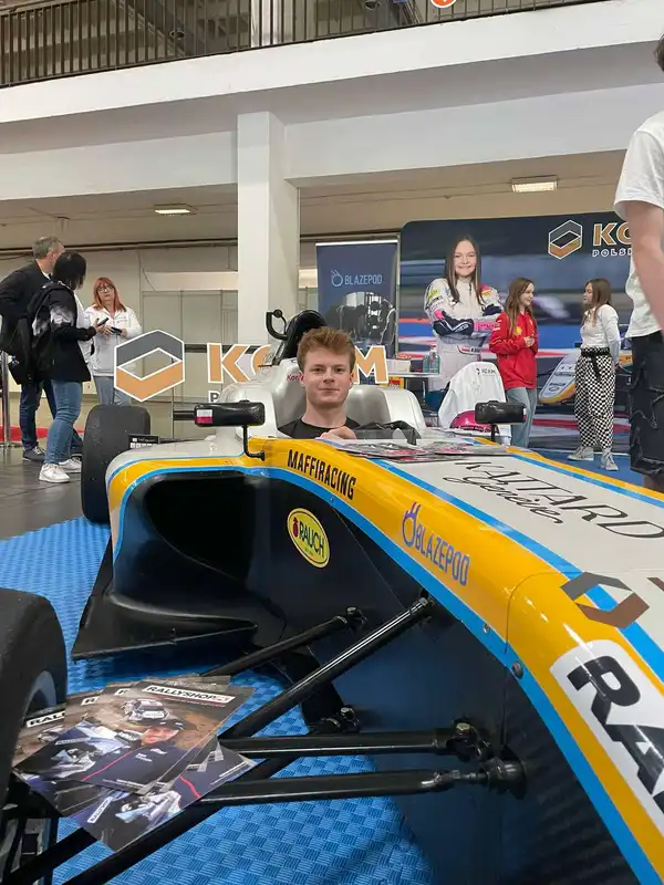Sitting in an F4 vehicle at 'Poznań MotorShow'.