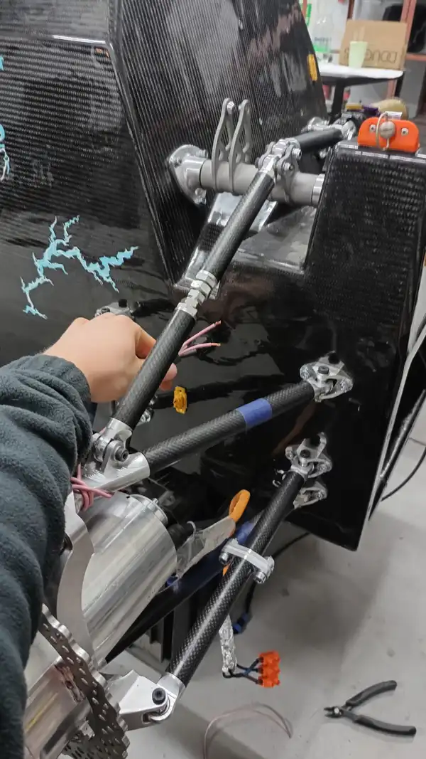 Mounting a high-voltage circuit breaker on a racing car.